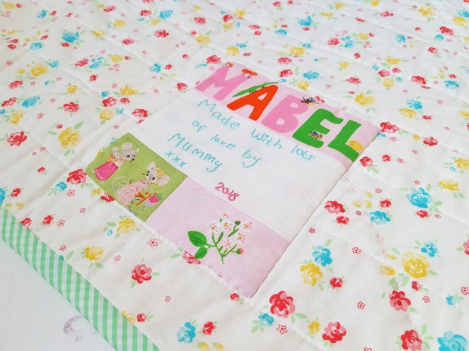 Bunnies and Blossoms flying geese quilt label